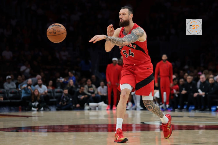 Dec 15, 2025; Miami, Florida, USA; Toronto Raptors forward Sandro Mamukelashvili (54) passes the ball against the Miami Heat during the first quarter at Kaseya Center. Credit: Sam Navarro-Imagn Images