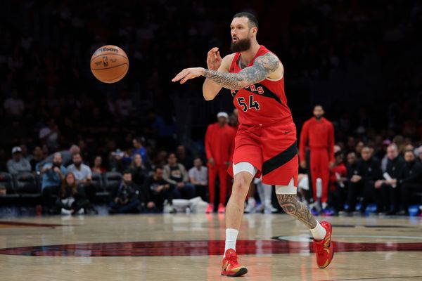 Dec 15, 2025; Miami, Florida, USA; Toronto Raptors forward Sandro Mamukelashvili (54) passes the ball against the Miami Heat during the first quarter at Kaseya Center. Mandatory Credit: Sam Navarro-Imagn Images