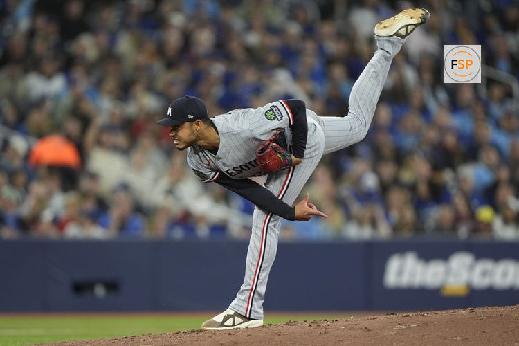 Apr 12, 2026; Toronto, Ontario, CAN; Minnesota Twins starting pitcher Taj Bradley (26) on his pitching follow through against the Toronto Blue Jays during the second inning at Rogers Centre. Credit: John E. Sokolowski-Imagn Images