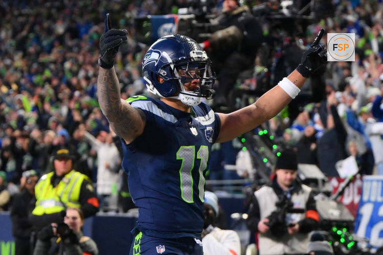 Jan 25, 2026; Seattle, WA, USA; Seattle Seahawks wide receiver Jaxon Smith-Njigba (11) celebrates after scoring a touchdown against the Los Angeles Rams during the first half in the 2026 NFC Championship Game at Lumen Field. Credit: Steven Bisig-Imagn Images