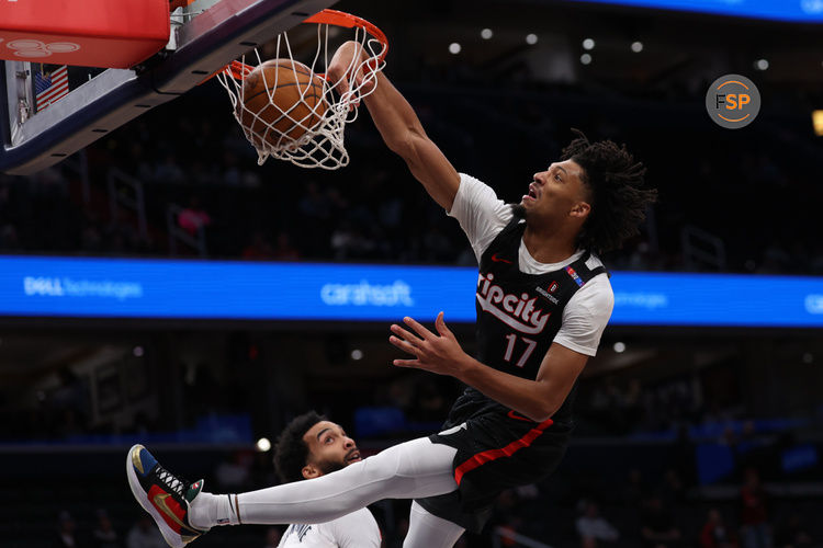 Feb 26, 2025; Washington, District of Columbia, USA; Portland Trail Blazers guard Shaedon Sharpe (17) dunks the ball over Washington Wizards forward Justin Champagnie (9) in the first half at Capital One Arena. Credit: Geoff Burke-Imagn Images