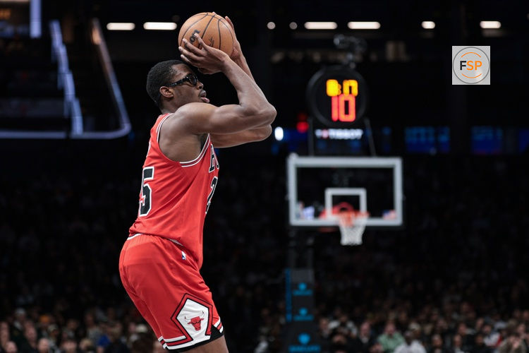 Jan 16, 2026; Brooklyn, New York, USA; Chicago Bulls forward Jalen Smith (25) makes a three point basket during the second half against the Brooklyn Nets at Barclays Center. Credit: Vincent Carchietta-Imagn Images