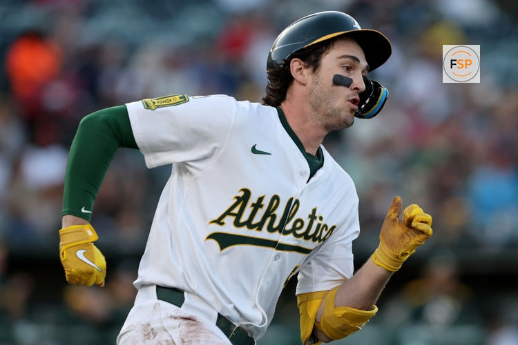 May 24, 2025; West Sacramento, California, USA; Athletics shortstop Jacob Wilson (5) runs to first on a ground rule double against the Philadelphia Phillies during the first inning at Sutter Health Park. Credit: Dennis Lee-Imagn Images