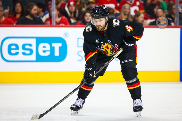 Oct 26, 2024; Calgary, Alberta, CAN; Calgary Flames defenseman Rasmus Andersson (4) against the Winnipeg Jets during the second period at Scotiabank Saddledome. Credit: Sergei Belski-Imagn Images