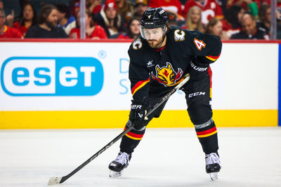 Oct 26, 2024; Calgary, Alberta, CAN; Calgary Flames defenseman Rasmus Andersson (4) against the Winnipeg Jets during the second period at Scotiabank Saddledome. Mandatory Credit: Sergei Belski-Imagn Images