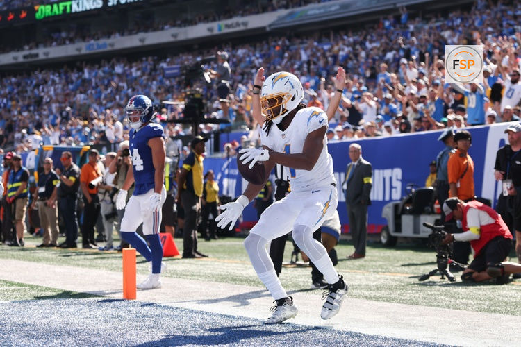 Sep 28, 2025; East Rutherford, New Jersey, USA; Los Angeles Chargers wide receiver Quentin Johnston (1) celebrates after scoring a touchdown during the second quarter against the New York Giants at MetLife Stadium. Credit: Vincent Carchietta-Imagn Images