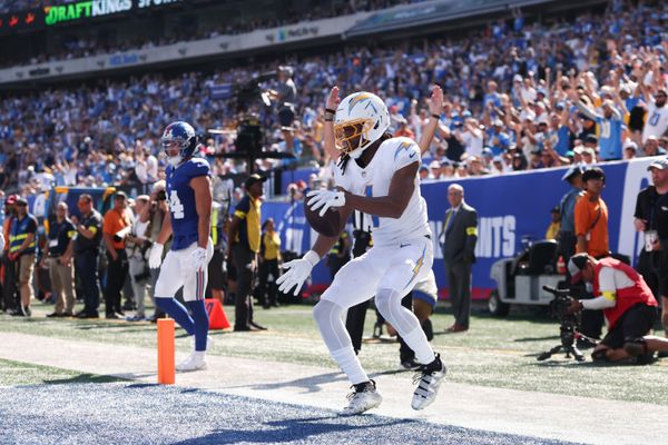 Sep 28, 2025; East Rutherford, New Jersey, USA; Los Angeles Chargers wide receiver Quentin Johnston (1) celebrates after scoring a touchdown during the second quarter against the New York Giants at MetLife Stadium. Mandatory Credit: Vincent Carchietta-Imagn Images