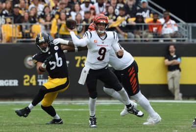 Sep 27, 2026; Pittsburgh, Pennsylvania, USA;  Cincinnati Bengals quarterback Joe Burrow (9) throws during the fourth quarter against Pittsburgh Steelers linebacker Alex Highsmith (56) at Acrisure Stadium.  Mandatory Credit: Charles LeClaire-Imagn Images