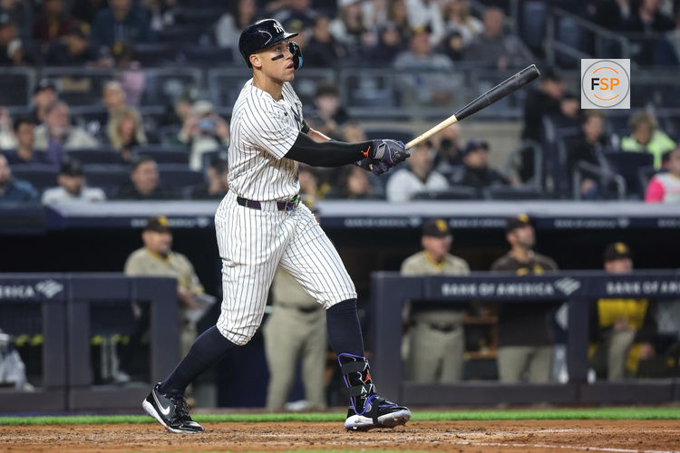 May 6, 2025; Bronx, New York, USA;  New York Yankees right fielder Aaron Judge (99) hits a solo home run in the fourth inning against the San Diego Padres at Yankee Stadium. Credit: Wendell Cruz-Imagn Images