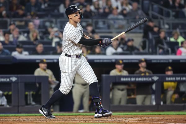 May 6, 2025; Bronx, New York, USA;  New York Yankees right fielder Aaron Judge (99) hits a solo home run in the fourth inning against the San Diego Padres at Yankee Stadium. Mandatory Credit: Wendell Cruz-Imagn Images