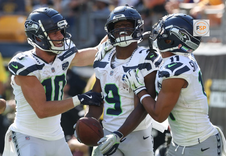 Sep 14, 2025; Pittsburgh, Pennsylvania, USA;  Seattle Seahawks wide receivers Cooper Kupp (10) and Jaxon Smith-Njigba (11) congratulate running back Kenneth Walker III (9) on his touchdown against the Pittsburgh Steelers during the fourth quarter at Acrisure Stadium. Credit: Charles LeClaire-Imagn Images