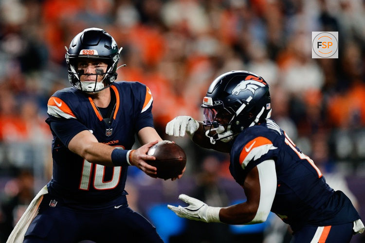 Sep 29, 2025; Denver, Colorado, USA; Denver Broncos quarterback Bo Nix (10) hands the ball off to Denver Broncos running back RJ Harvey (12) during the fourth quarter against the Cincinnati Bengals at Empower Field at Mile High. Credit: Isaiah J. Downing-Imagn Images