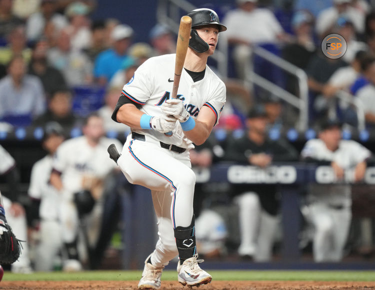 Jul 1, 2025; Miami, Florida, USA;  Miami Marlins left fielder Kyle Stowers (28) hits a single in the seventh inning at  loanDepot Park against the Minnesota Twins. Credit: Jim Rassol-Imagn Images