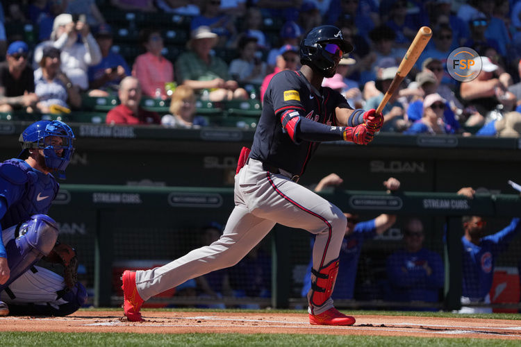 Mar 24, 2025; Mesa, Arizona, USA; Atlanta Braves outfielder Jurickson Profar (7) hits against the Chicago Cubs in the first inning at Sloan Park. Credit: Rick Scuteri-Imagn Images