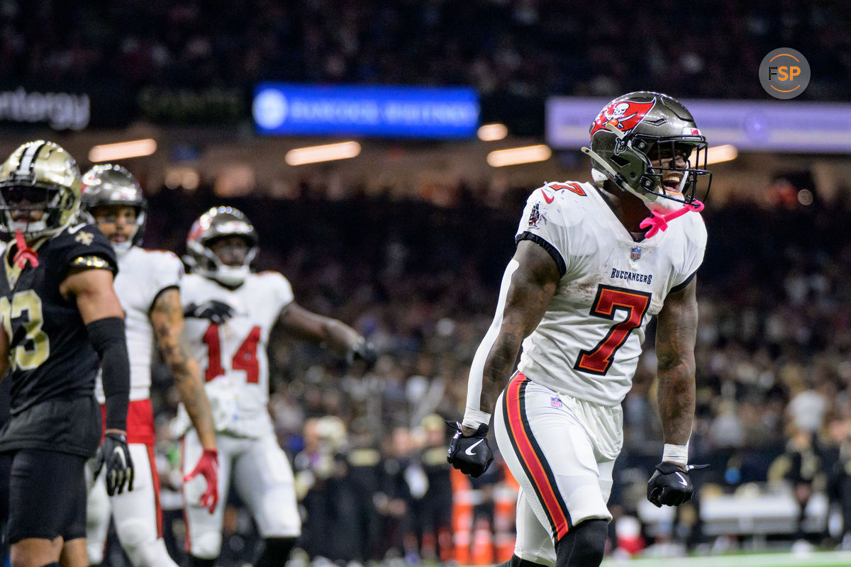 Oct 13, 2024; New Orleans, Louisiana, USA; Tampa Bay Buccaneers running back Bucky Irving (7) celebrates during the fourth quarter against the New Orleans Saints at Caesars Superdome. Credit: Matthew Hinton-Imagn Images