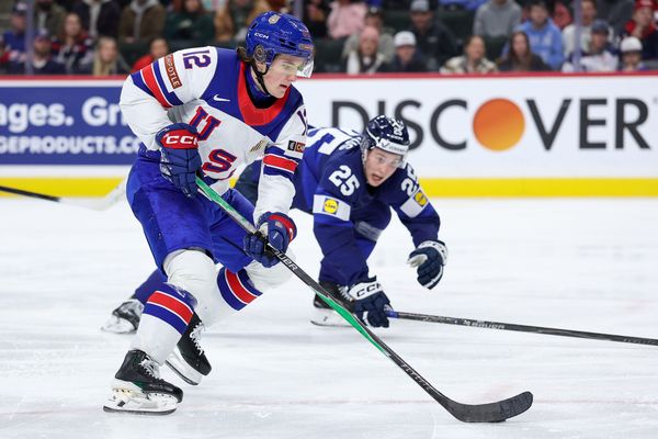 Jan 2, 2026; St. Paul, Minnesota, UNITED STATES; United States forward Will Zellers (12) skates with the puck as Finland defenseman Lasse Boelius (25) defends during the third period in the quarterfinals of the 2026 IIHF World Junior Championship at Grand Casino Arena. Mandatory Credit: Matt Krohn-Imagn Images