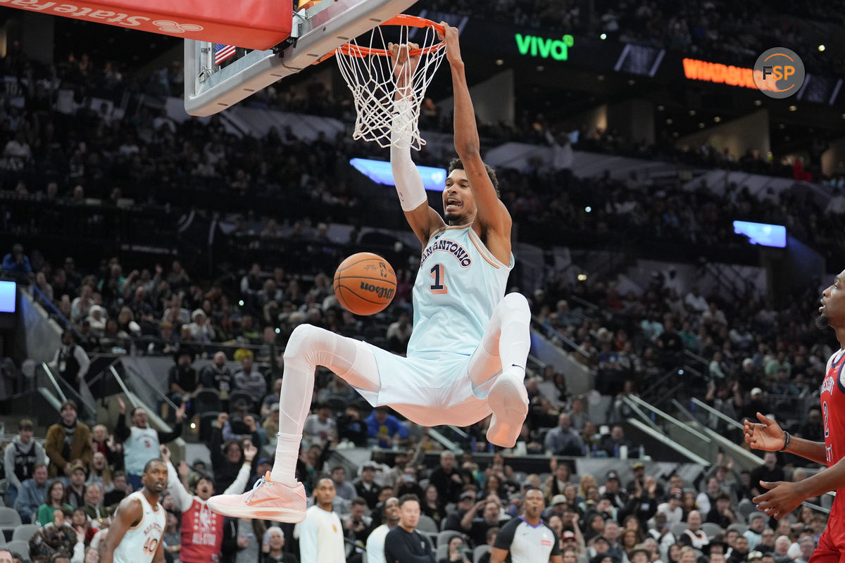 Dec 8, 2024; San Antonio, Texas, USA;  San Antonio Spurs center Victor Wembanyama (1) dunks in the second half against the New Orleans Pelicans at Frost Bank Center. Credit: Daniel Dunn-Imagn Images