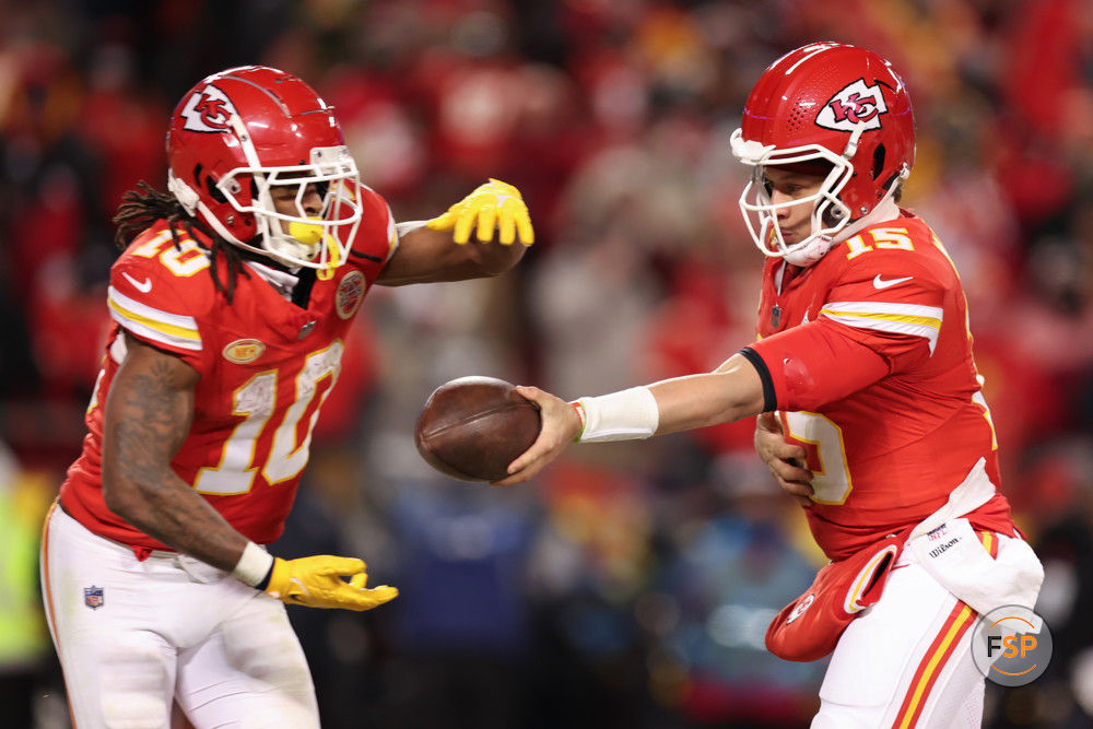 KANSAS CITY, MO - JANUARY 13: Kansas City Chiefs quarterback Patrick Mahomes (15) hands off to running back Isiah Pacheco (10) in the fourth quarter of an AFC Wild Card playoff game between the Miami Dolphins and Kansas City Chiefs on Jan 13, 2024 at GEHA Field at Arrowhead Stadium in Kansas City, MO. (Photo by Scott Winters/Icon Sportswire)