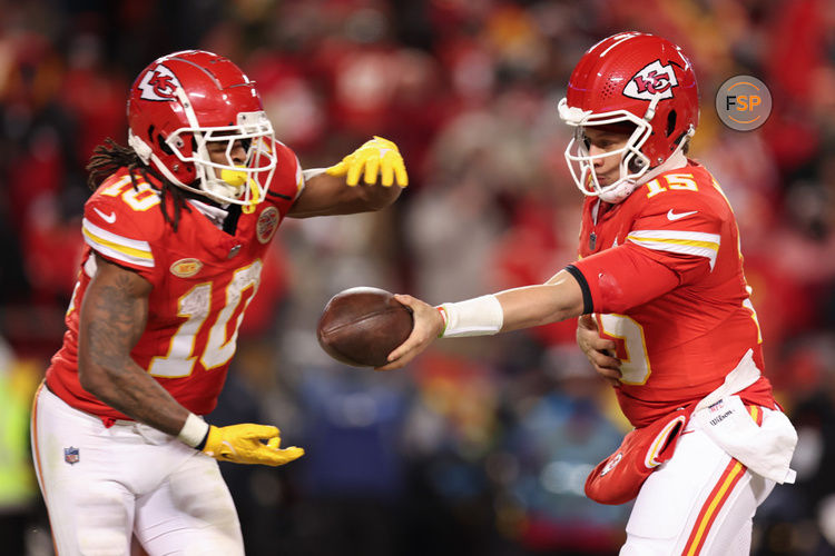 KANSAS CITY, MO - JANUARY 13: Kansas City Chiefs quarterback Patrick Mahomes (15) hands off to running back Isiah Pacheco (10) in the fourth quarter of an AFC Wild Card playoff game between the Miami Dolphins and Kansas City Chiefs on Jan 13, 2024 at GEHA Field at Arrowhead Stadium in Kansas City, MO. (Photo by Scott Winters/Icon Sportswire)