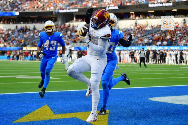 Oct 5, 2025; Inglewood, California, USA; Washington Commanders wide receiver Deebo Samuel Sr. (1) makes a catch for a touchdown against the Los Angeles Chargers in the second half at SoFi Stadium. Credit: Gary A. Vasquez-Imagn Images