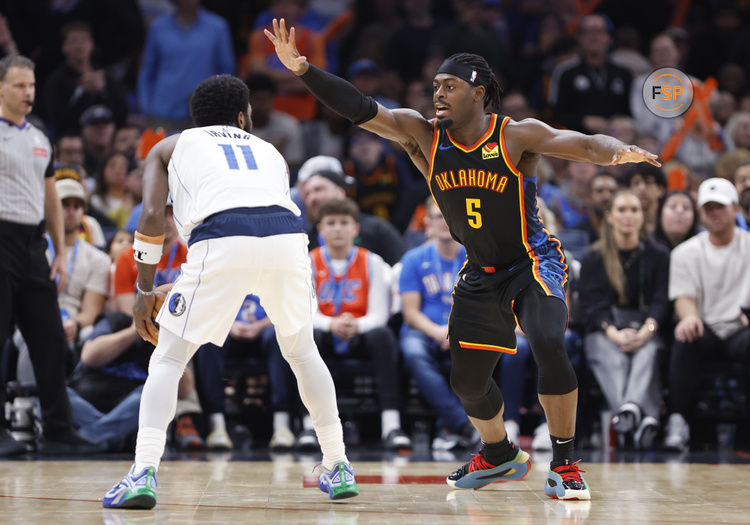 Nov 17, 2024; Oklahoma City, Oklahoma, USA; Oklahoma City Thunder guard Luguentz Dort (5) defends Dallas Mavericks guard Kyrie Irving (11) during the second half at Paycom Center. Credit: Alonzo Adams-Imagn Images