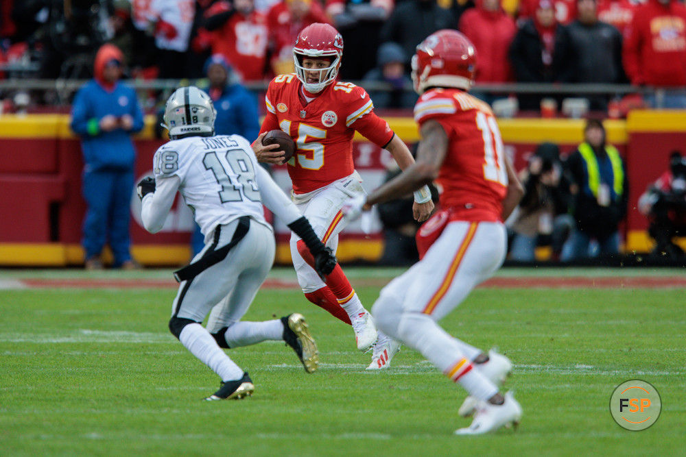 KANSAS CITY, MO - DECEMBER 25: Kansas City Chiefs quarterback Patrick Mahomes (15) scrambles in the back field during the second half against the Las Vegas Raiders on December 25th, 2023 at Arrowhead Stadium in Kansas City, Missouri. (Photo by William Purnell/Icon Sportswire)