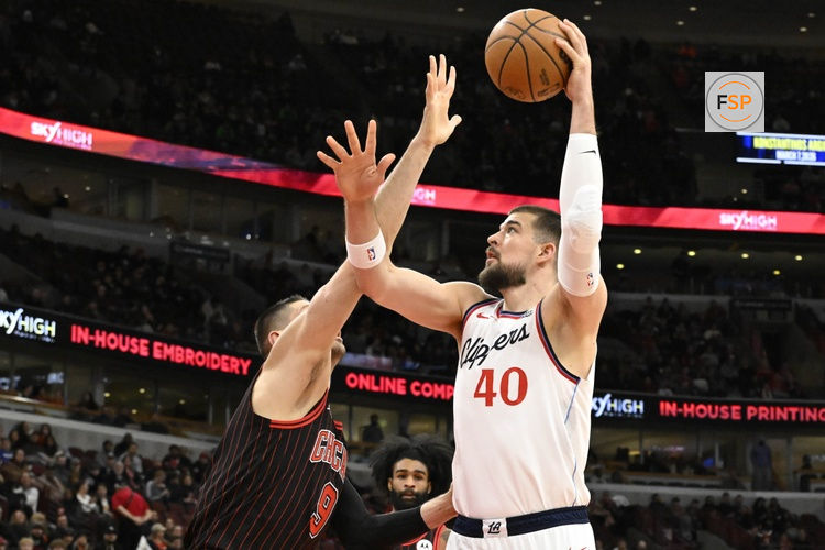 Jan 20, 2026; Chicago, Illinois, USA; LA Clippers center Ivica Zubac (40) shoots against Chicago Bulls center Nikola Vucevic (9) during the first half at United Center. Credit: Matt Marton-Imagn Images