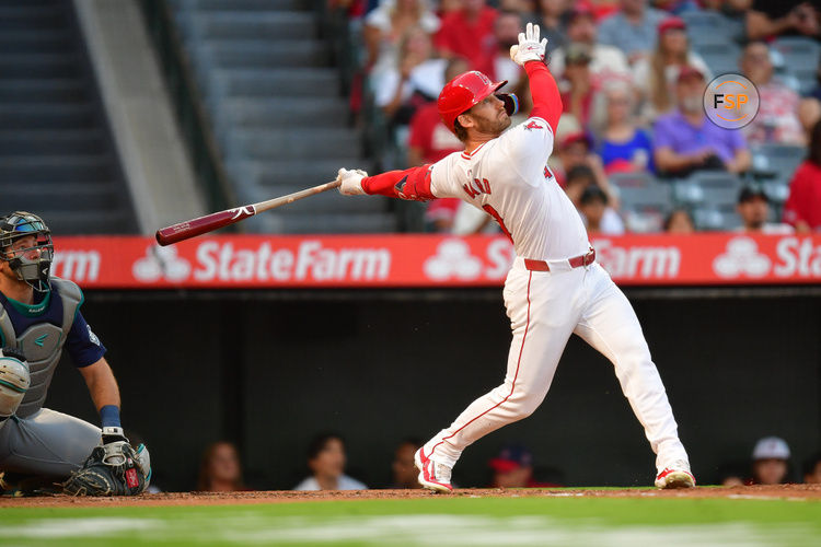 Aug 30, 2024; Anaheim, California, USA; Los Angeles Angels left fielder Taylor Ward (3) hits a solo home run against the Seattle Mariners during the first inning at Angel Stadium. Credit: Gary A. Vasquez-USA TODAY Sports