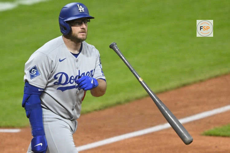 May 27, 2025; Cleveland, Ohio, USA; Los Angeles Dodgers third baseman Max Muncy (13) tosses his bat after hitting a three-run home run in the ninth inning against the Cleveland Guardians at Progressive Field. Credit: David Richard-Imagn Images