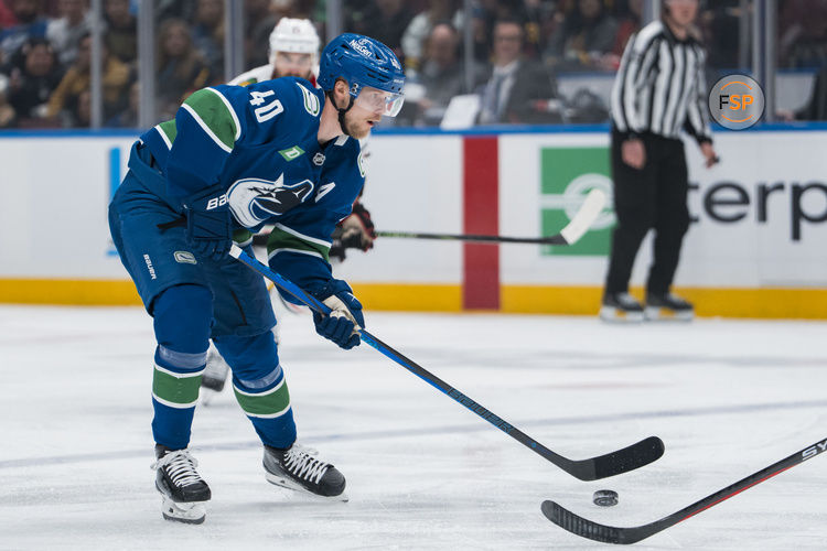 Mar 15, 2025; Vancouver, British Columbia, CAN; Vancouver Canucks forward Elias Pettersson (40) handles the puck against the Chicago Blackhawks in the third period at Rogers Arena. Credit: Bob Frid-Imagn Images