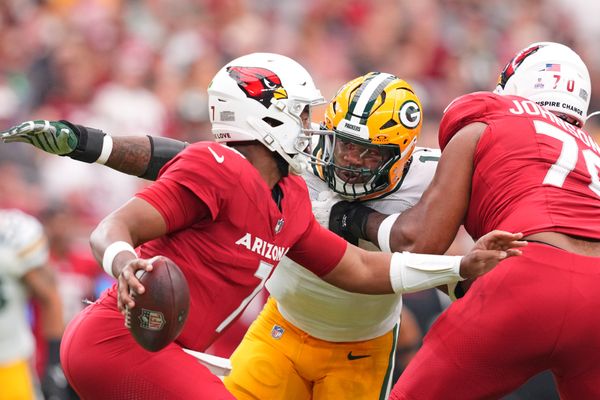 Oct 19, 2025; Glendale, Arizona, USA; Green Bay Packers defensive end Micah Parsons (1) pursues Arizona Cardinals quarterback Jacoby Brissett (7) during the first half at State Farm Stadium. Mandatory Credit: Joe Camporeale-Imagn Images
