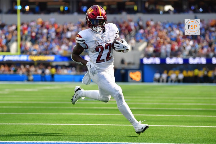 Oct 5, 2025; Inglewood, California, USA; Washington Commanders running back Jacory Croskey-Merritt (22) runs for a touchdown against the Los Angeles Chargers in the second half at SoFi Stadium. Credit: Gary A. Vasquez-Imagn Images