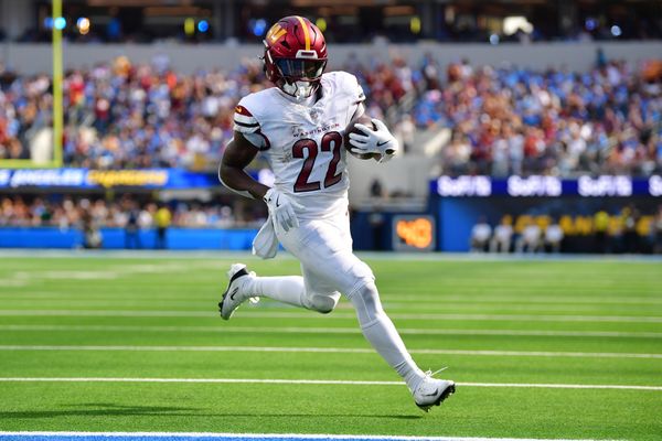 Oct 5, 2025; Inglewood, California, USA; Washington Commanders running back Jacory Croskey-Merritt (22) runs for a touchdown against the Los Angeles Chargers in the second half at SoFi Stadium. Mandatory Credit: Gary A. Vasquez-Imagn Images