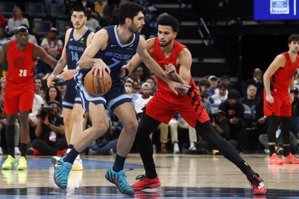Dec 7, 2025; Memphis, Tennessee, USA; Memphis Grizzlies forward Santi Aldama (7) dribbles as Portland Trail Blazers forward Toumani Camara (33) defends during the second quarter at FedExForum. Mandatory Credit: Petre Thomas-Imagn Images