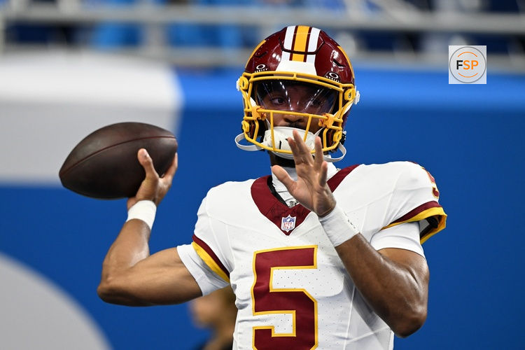 Aug 22, 2026; Detroit, Michigan, USA;  Washington Commanders quarterback Jayden Daniels (5) throws passes during pregame warmups before their preseason game against the Detroit Lions at Ford Field.  Credit: Lon Horwedel-Imagn Images