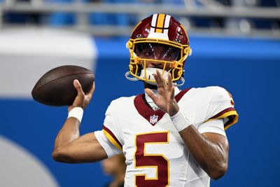Aug 22, 2026; Detroit, Michigan, USA;  Washington Commanders quarterback Jayden Daniels (5) throws passes during pregame warmups before their preseason game against the Detroit Lions at Ford Field.  Mandatory Credit: Lon Horwedel-Imagn Images