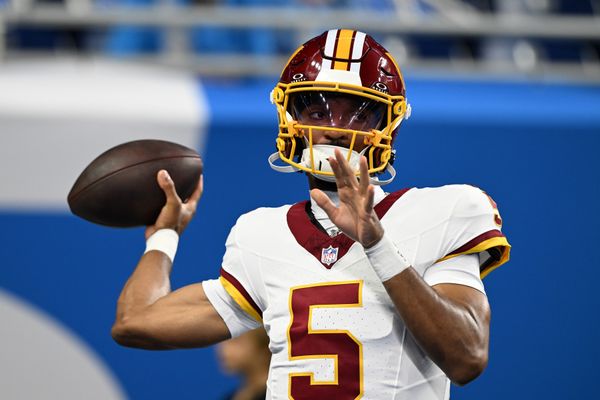 Aug 22, 2026; Detroit, Michigan, USA;  Washington Commanders quarterback Jayden Daniels (5) throws passes during pregame warmups before their preseason game against the Detroit Lions at Ford Field.  Mandatory Credit: Lon Horwedel-Imagn Images