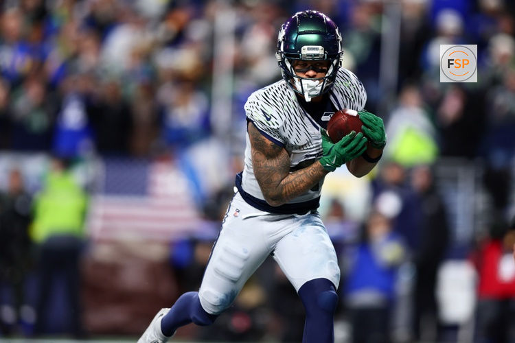 Dec 18, 2025; Seattle, Washington, USA; Seattle Seahawks wide receiver Jaxon Smith-Njigba (11) runs for a touchdown against the Los Angeles Rams in overtime at Lumen Field. Credit: Kevin Ng-Imagn Images