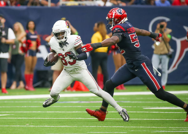 HOUSTON, TX - NOVEMBER 19:  Arizona Cardinals wide receiver Greg Dortch (83) carries the ball in the fourth quarter during the NFL game between the Arizona Cardinals and Houston Texans on November 19, 2023 at NRG Stadium in Houston, Texas.  (Photo by Leslie Plaza Johnson/Icon Sportswire)