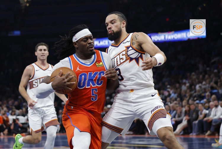 Nov 28, 2025; Oklahoma City, Oklahoma, USA; Oklahoma City Thunder guard Luguentz Dort (5) drives to the basket against Phoenix Suns forward Dillon Brooks (3) during the second half at Paycom Center. Credit: Alonzo Adams-Imagn Images