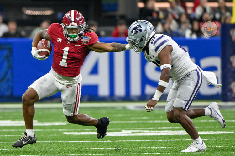 NEW ORLEANS, LA - DECEMBER 31: Alabama Crimson Tide running back Jahmyr Gibbs (1) stiff arms Kansas State Wildcats safety Drake Cheatum (21) during first half action during the Sugar Bowl between the Alabama Crimson Tide and Kansas State Wildcats at Caesars Superdome on December 31, 2022 in New Orleans, LA. (Photo by Ken Murray/Icon Sportswire)