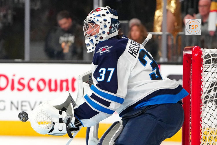Apr 13, 2026; Las Vegas, Nevada, USA; Winnipeg Jets goaltender Connor Hellebuyck (37) warms up before the start of a game against the Vegas Golden Knights at T-Mobile Arena. Credit: Stephen R. Sylvanie-Imagn Images