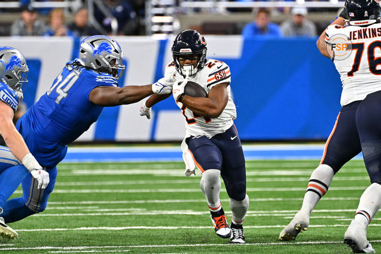 DETROIT, MI - NOVEMBER 19: Chicago Bears running back Khalil Herbert (24) runs past Detroit Lions defensive tackle Alim McNeill (54) during the Detroit Lions versus the Chicago Bears game on Sunday November 19, 2023 at Ford Field in Detroit, MI. (Photo by Steven King/Icon Sportswire)