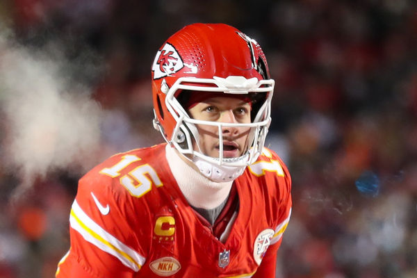 KANSAS CITY, MO - JANUARY 13: Kansas City Chiefs quarterback Patrick Mahomes (15) looks up before the snap in the fourth quarter of an AFC Wild Card playoff game between the Miami Dolphins and Kansas City Chiefs on Jan 13, 2024 at GEHA Field at Arrowhead Stadium in Kansas City, MO. (Photo by Scott Winters/Icon Sportswire)