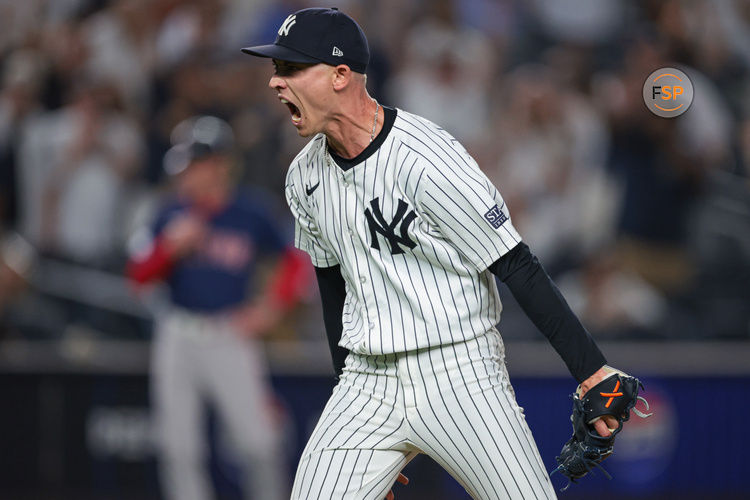 Sep 13, 2024; Bronx, New York, USA; New York Yankees relief pitcher Luke Weaver (30) reacts after closing the game against the Boston Red Sox at Yankee Stadium. Credit: Vincent Carchietta-Imagn Images