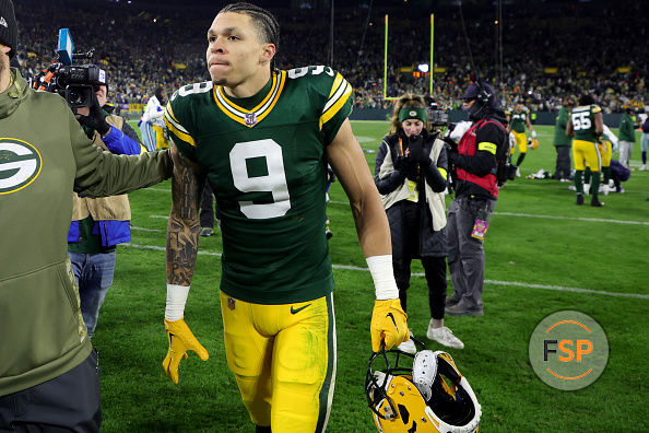 GREEN BAY, WISCONSIN - NOVEMBER 13: Christian Watson #9 of the Green Bay Packers walks off the field after his team's 31-28 overtime win against the Dallas Cowboys at Lambeau Field on November 13, 2022 in Green Bay, Wisconsin. (Photo by Stacy Revere/Getty Images)