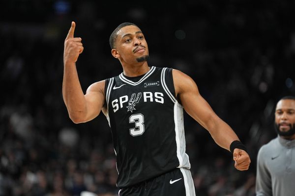Nov 18, 2025; San Antonio, Texas, USA;  San Antonio Spurs forward Keldon Johnson (3) celebrates in the second half against the Memphis Grizzlies at Frost Bank Center. Mandatory Credit: Daniel Dunn-Imagn Images