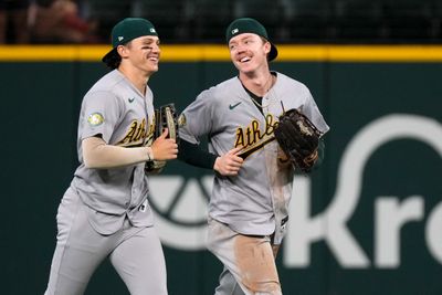 Sep 2, 2026; Arlington, Texas, USA;  Athletics left fielder Zack Gelof (20) and center fielder Henry Bolte (33) run off the field after defeating the Texas Rangers at Globe Life Field. Mandatory Credit: Raymond Carlin III-Imagn Images