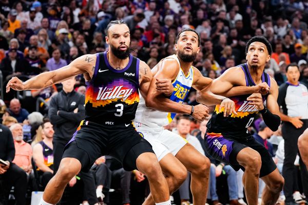 Nov 13, 2025; Phoenix, Arizona, USA; Phoenix Suns forward Dillon Brooks (3) and Phoenix Suns forward Ryan Dunn (0) during a free throw shot at Mortgage Matchup Center. Mandatory Credit: Arianna Grainey-Imagn Images