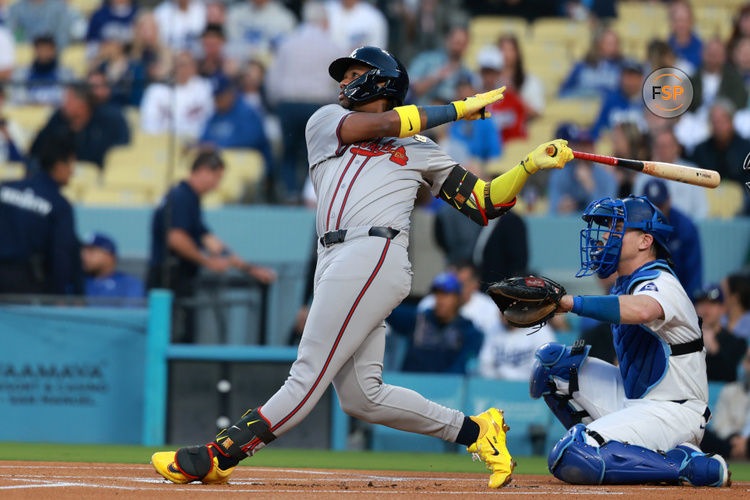 May 3, 2024; Los Angeles, California, USA;  Atlanta Braves outfielder Ronald Acuna Jr. (13) hits a single in the first inning against the Los Angeles Dodgers at Dodger Stadium. Credit: Kiyoshi Mio-USA TODAY Sports